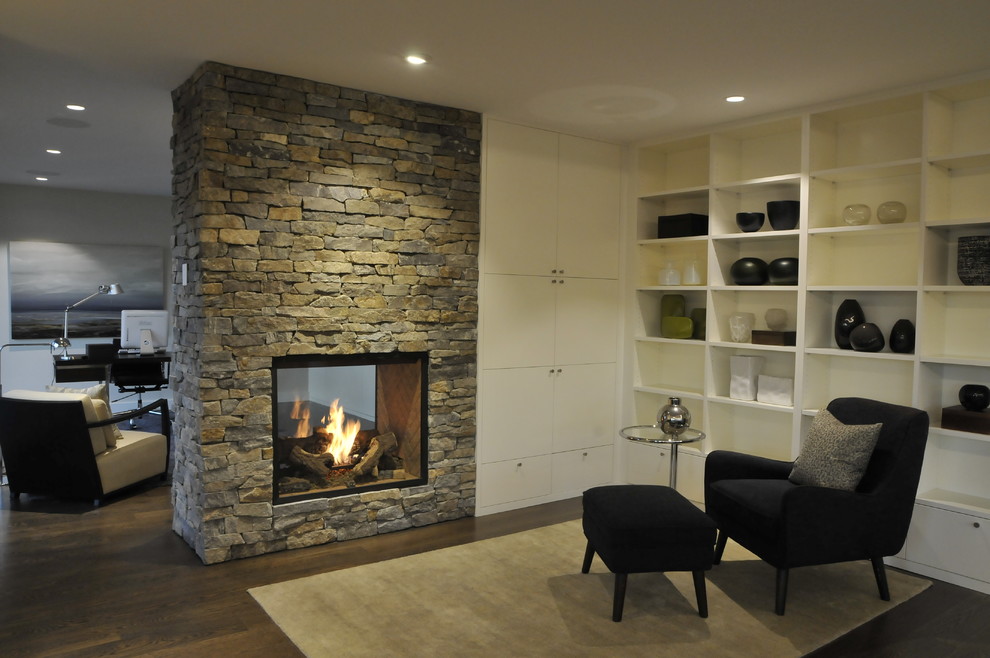 Mid-sized modern open concept family room in Vancouver with white walls, dark hardwood floors, a two-sided fireplace, a stone fireplace surround and brown floor.