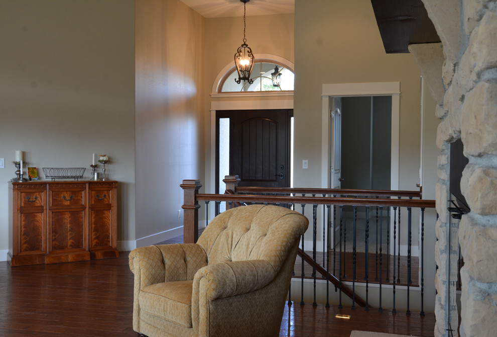 Entryway - large transitional formal and open concept entryway idea with a standard fireplace, a stone fireplace and no tv