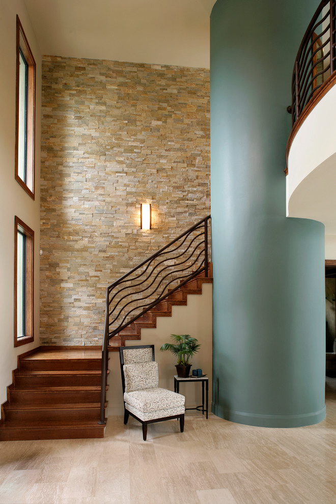 Photo of a contemporary wood l-shaped staircase in Detroit with wood risers.