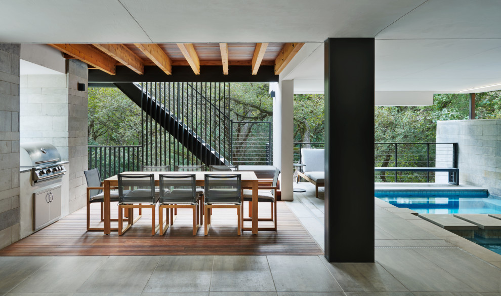 Inspiration pour une grande terrasse minimaliste.