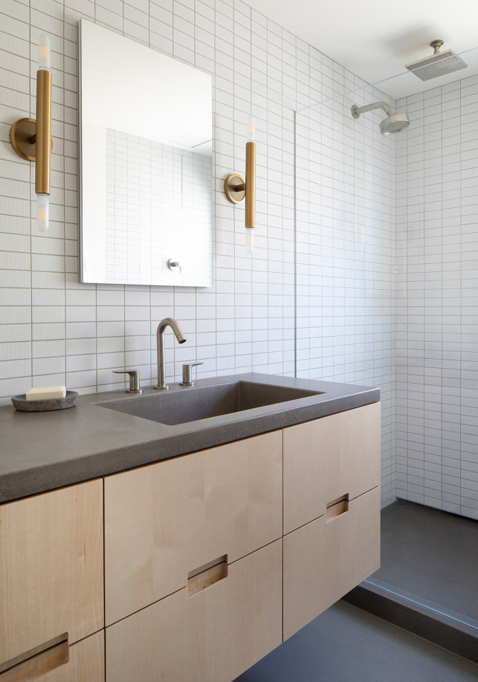 Mid-sized modern master bathroom in San Francisco with flat-panel cabinets, white tile, ceramic tile, concrete benchtops, grey benchtops, light wood cabinets, an alcove shower, an integrated sink, grey floor and a floating vanity.
