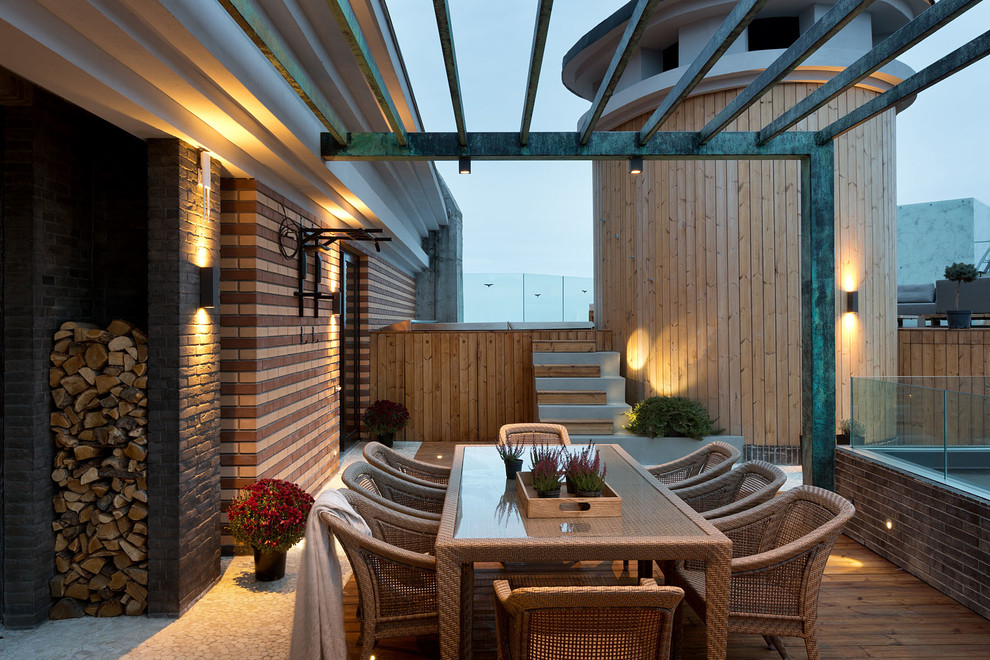 Photo of a contemporary rooftop and rooftop deck in Other with a pergola.