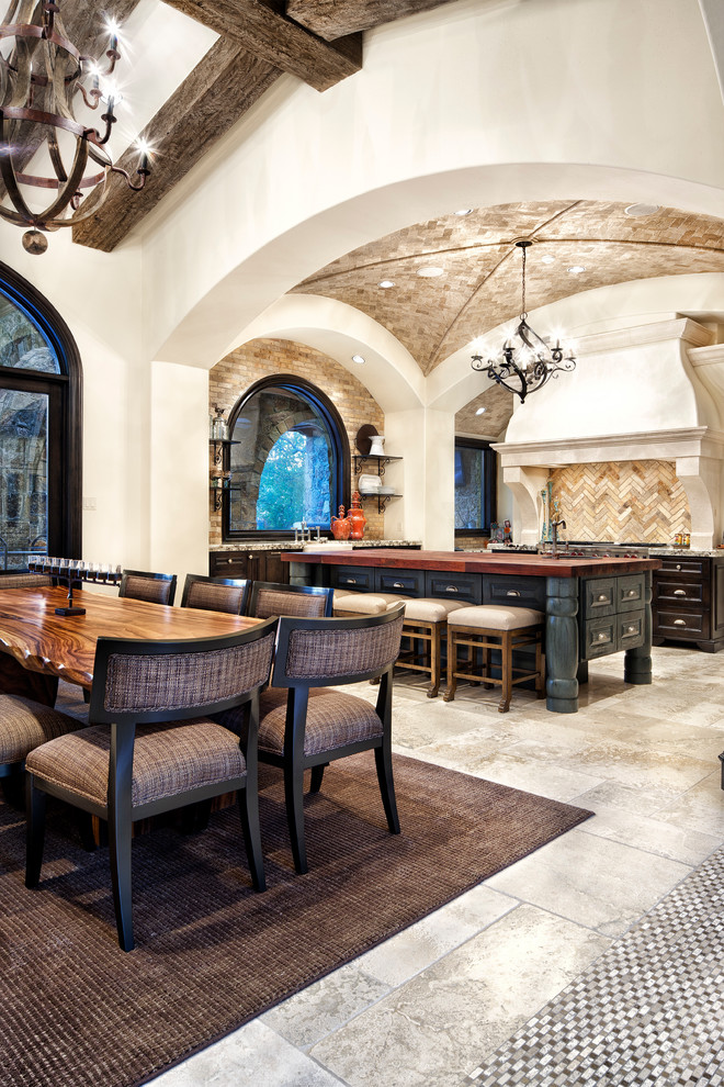 Inspiration for a mediterranean open plan dining in Austin with white walls.