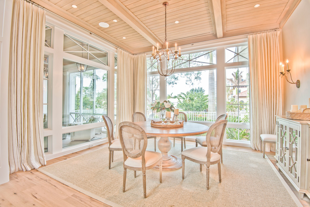 Elegant dining with floor to ceiling windows Traditional Dining Room Tampa by Nautilus Homes