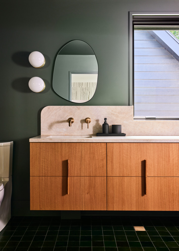 Design ideas for a mid-sized contemporary kids bathroom in Grand Rapids with flat-panel cabinets, light wood cabinets, a shower/bathtub combo, a two-piece toilet, green walls, ceramic floors, an undermount sink, green floor, a single vanity and a floating vanity.