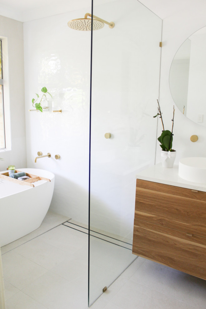 Mid-sized modern kids wet room bathroom in Perth with flat-panel cabinets, dark wood cabinets, a freestanding tub, white tile, porcelain tile, white walls, porcelain floors, a vessel sink, engineered quartz benchtops, grey floor, an open shower, white benchtops, a single vanity and a floating vanity.