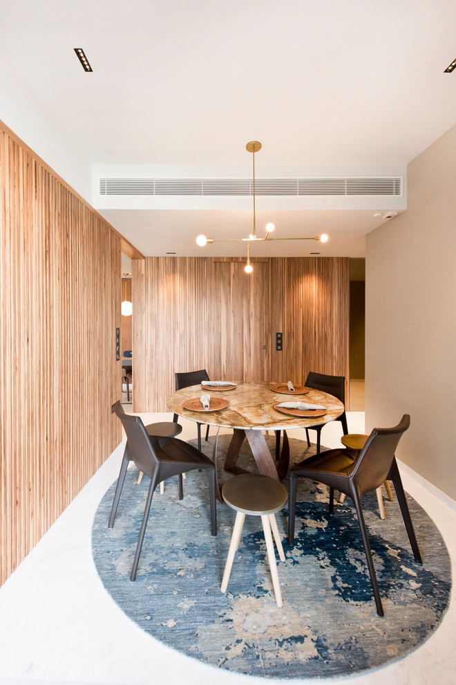 Photo of a mid-sized contemporary separate dining room in Singapore with white walls and white floor.
