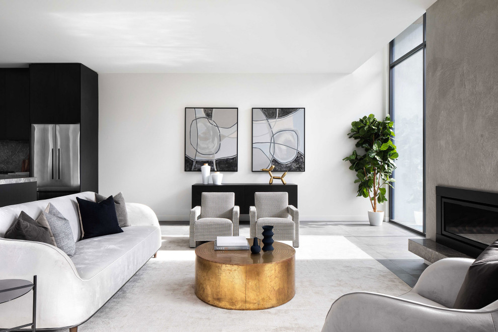 Contemporary open concept living room in Melbourne with white walls, porcelain floors, a standard fireplace, a concrete fireplace surround and grey floor.