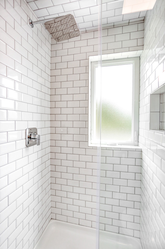 Alcove shower - small modern master white tile and ceramic tile vinyl floor, gray floor and single-sink alcove shower idea in Other with a two-piece toilet, gray walls, a pedestal sink, a hinged shower door and a floating vanity