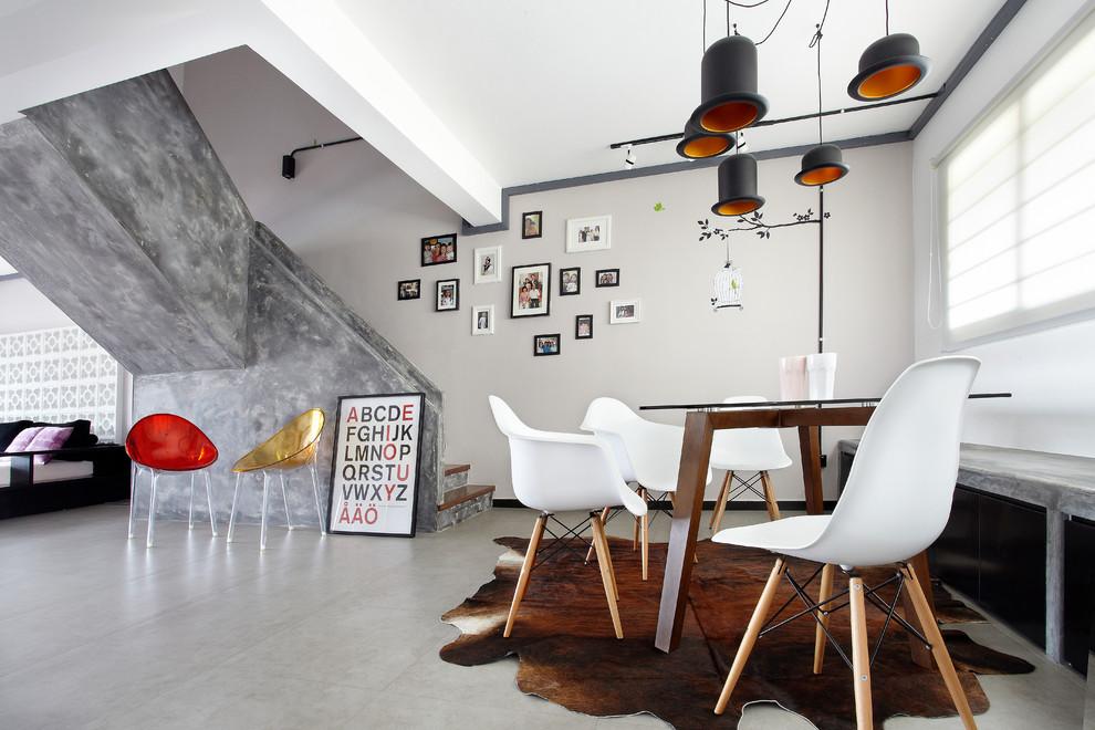 Photo of a contemporary open plan dining in Singapore with beige walls and beige floor.