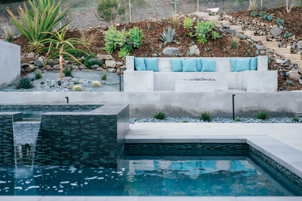 Inspiration for a small midcentury backyard patio in Orange County with a fire feature, concrete slab and no cover.