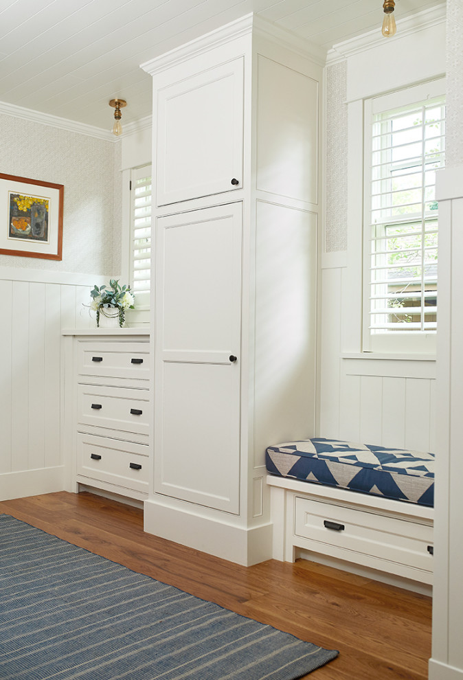 Mid-sized beach style mudroom in Grand Rapids with white walls and medium hardwood floors.