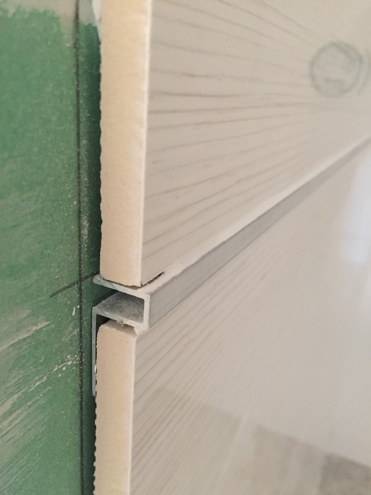 Tile trims not flush help please!