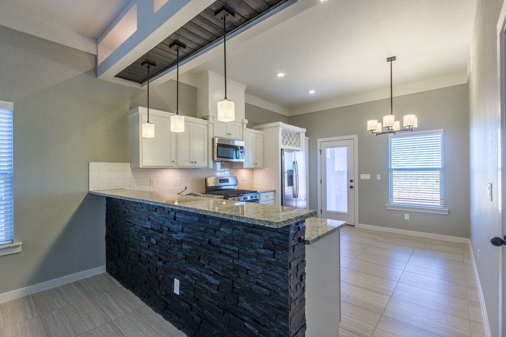 Example of a transitional home design design in Austin