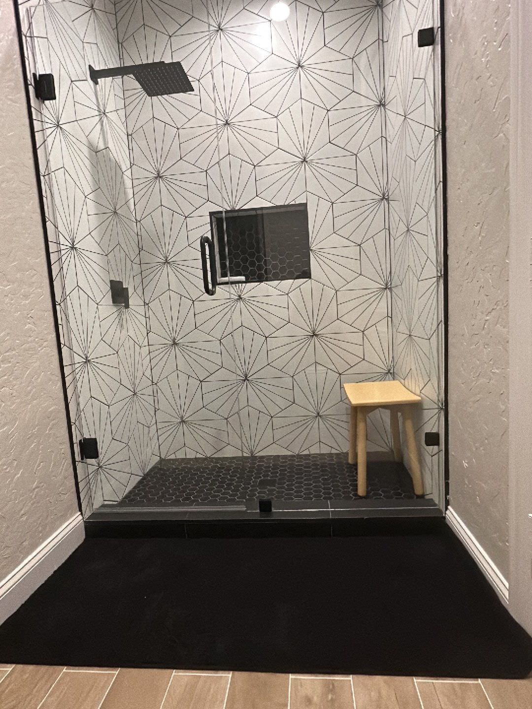 Bathroom - transitional 3/4 black and white tile and ceramic tile ceramic tile bathroom idea in Dallas with a hinged shower door