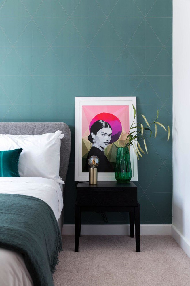 Inspiration for a contemporary bedroom in London with green walls, carpet and grey floor.