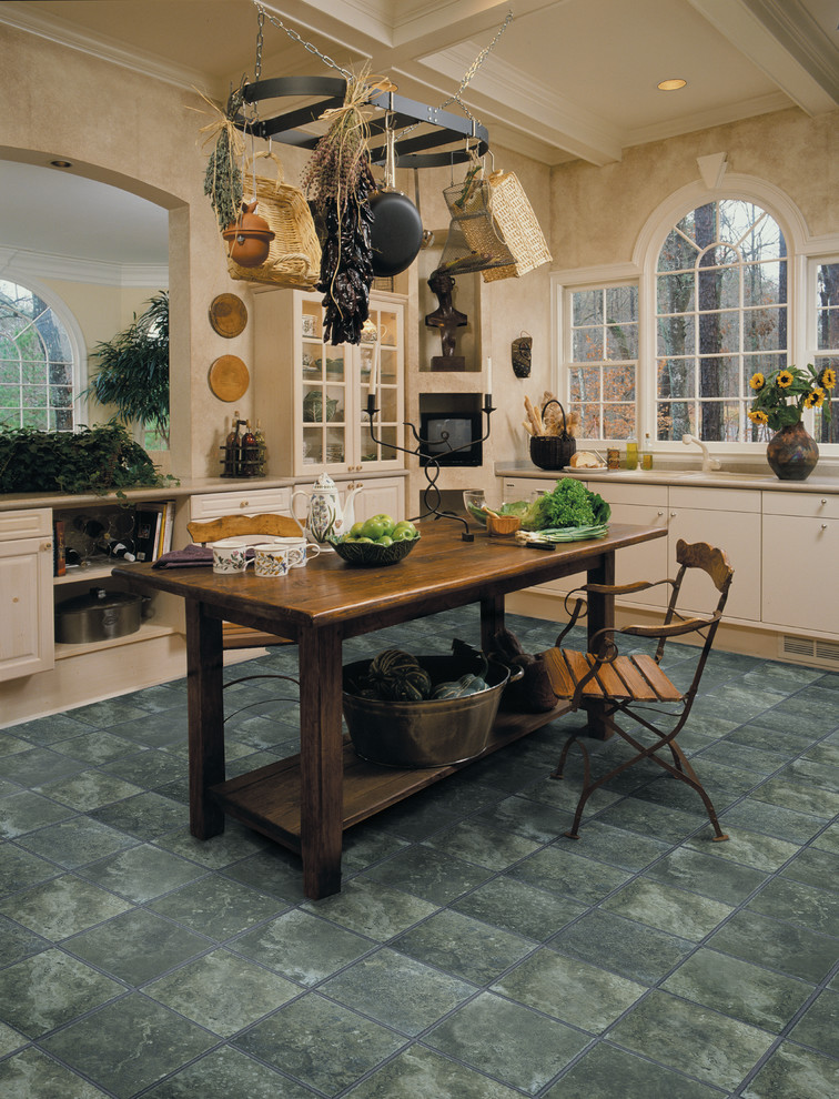 Kitchen - transitional kitchen idea in Miami with flat-panel cabinets, beige cabinets and an island