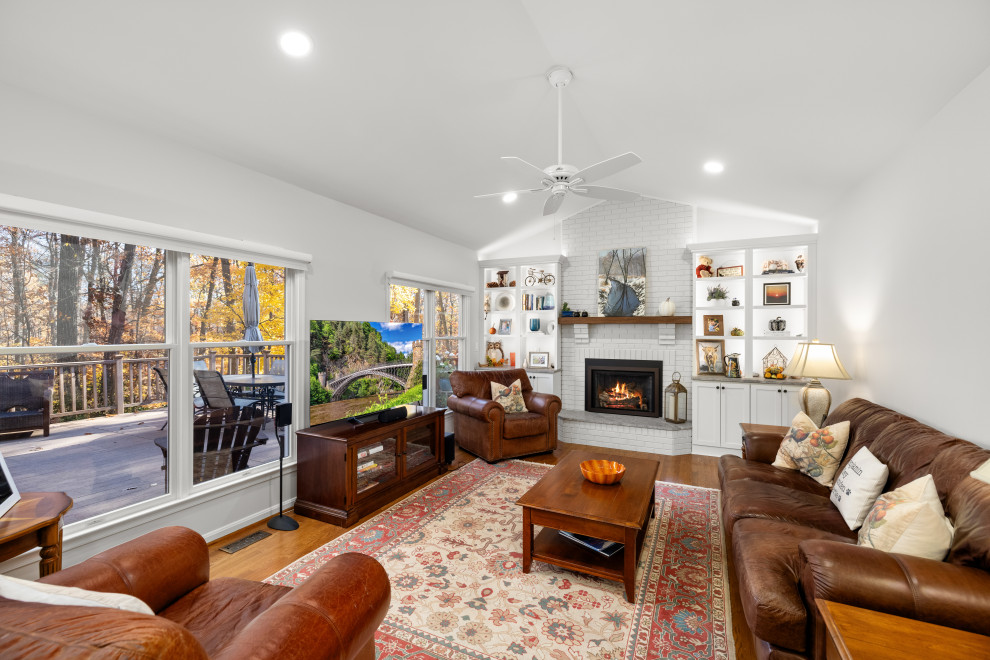 Kitchen - mid-sized transitional kitchen idea in DC Metro with shaker cabinets, white cabinets, quartz countertops, porcelain backsplash, stainless steel appliances and an island