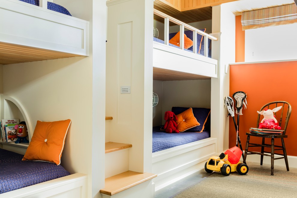 This is an example of a mid-sized transitional gender-neutral kids' bedroom for kids 4-10 years old in Boston with orange walls and carpet.