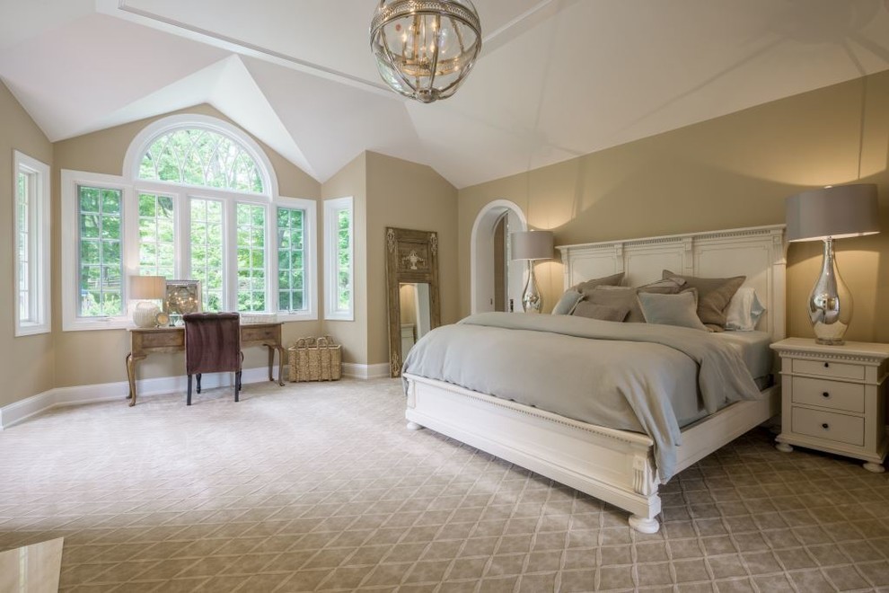 Design ideas for a large traditional master bedroom in Philadelphia with beige walls, carpet and a standard fireplace.