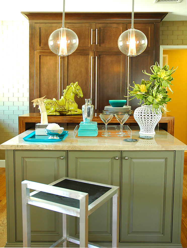 Photo of a contemporary kitchen in Los Angeles with beaded inset cabinets, limestone benchtops and green cabinets.
