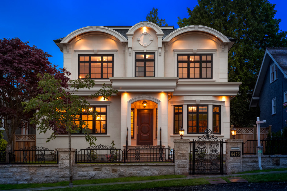 Design ideas for a traditional two-storey beige exterior in Vancouver.