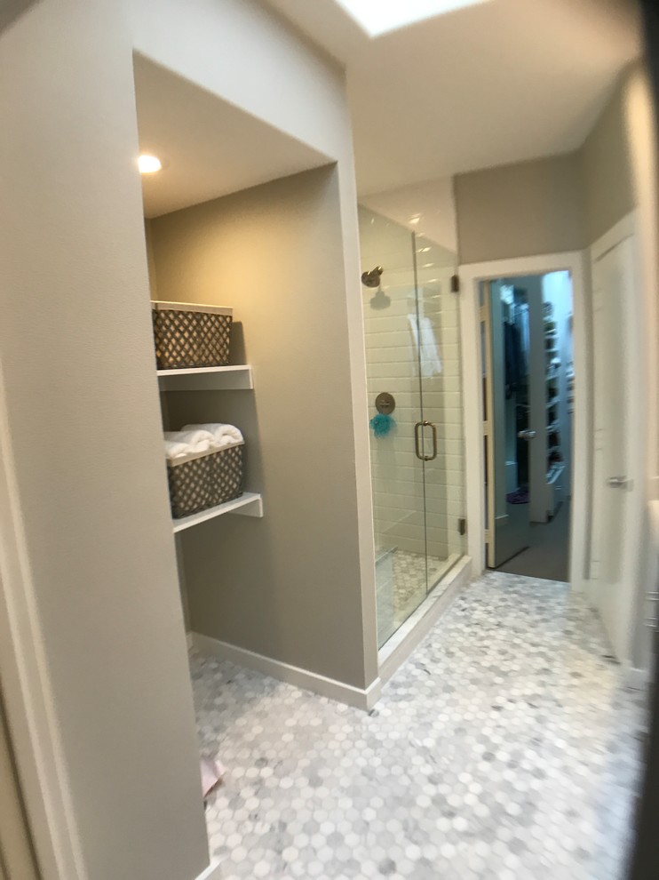 Inspiration for a large transitional master white tile and ceramic tile ceramic tile and multicolored floor alcove shower remodel in Dallas with shaker cabinets, white cabinets, a two-piece toilet, gray walls, an undermount sink, quartzite countertops and a hinged shower door