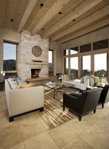 Example of a mid-sized trendy formal and loft-style limestone floor living room design in Albuquerque with beige walls, a standard fireplace and a stone fireplace