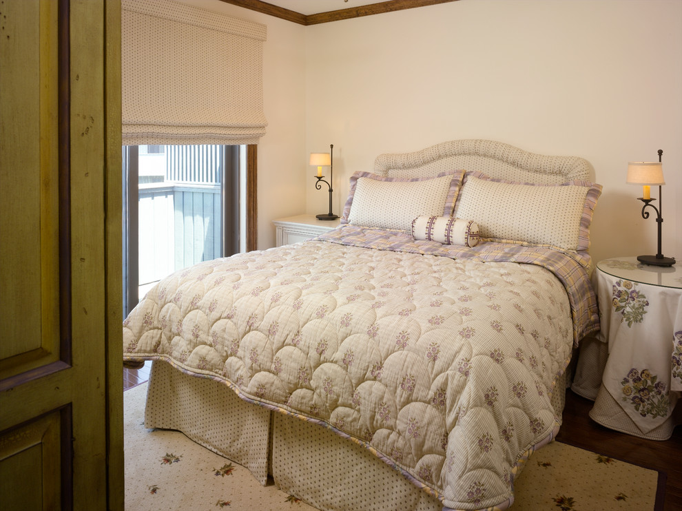 Mid-sized beach style guest bedroom in Newark with beige walls, dark hardwood floors and no fireplace.