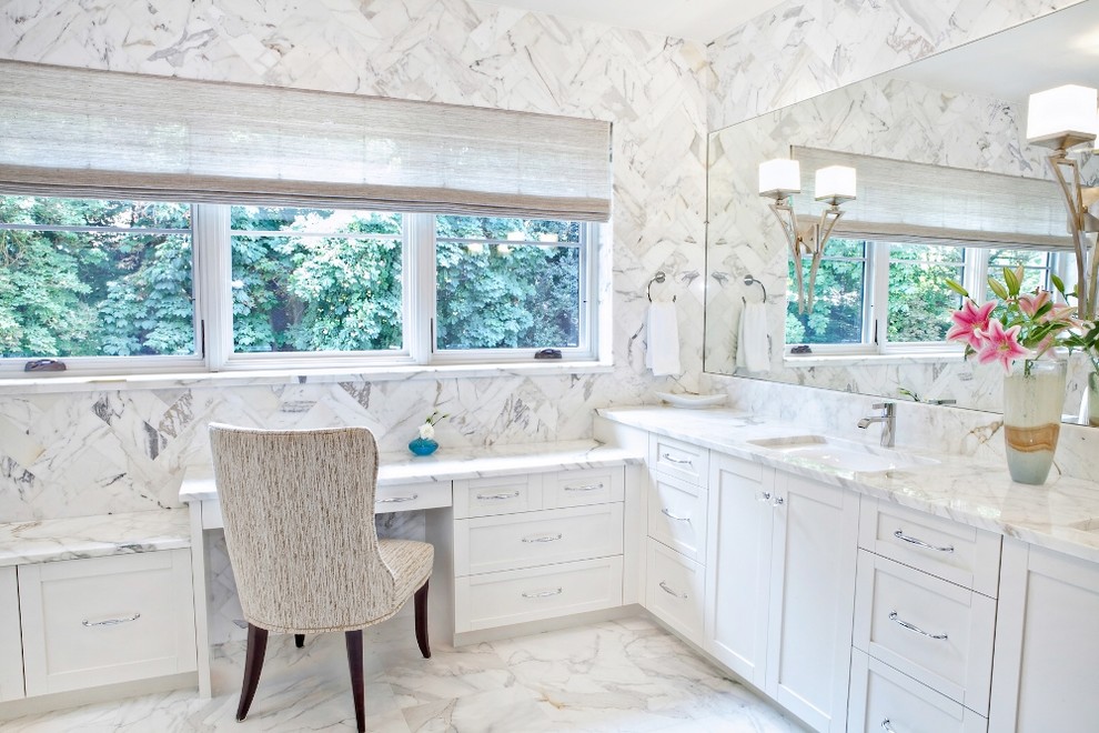 Photo of a mid-sized transitional master bathroom in Boise with shaker cabinets, white cabinets, marble benchtops, white tile, stone slab, white walls, marble floors, an undermount sink and white floor.