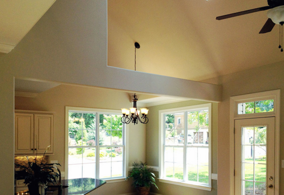 Inspiration for a mid-sized transitional carpeted kitchen/dining room combo remodel with beige walls