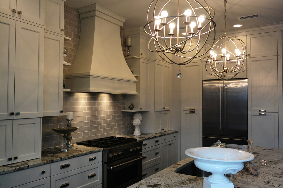Inspiration for a transitional l-shaped eat-in kitchen remodel in Chicago with a single-bowl sink, recessed-panel cabinets, white cabinets, quartzite countertops, gray backsplash, subway tile backsplash and stainless steel appliances