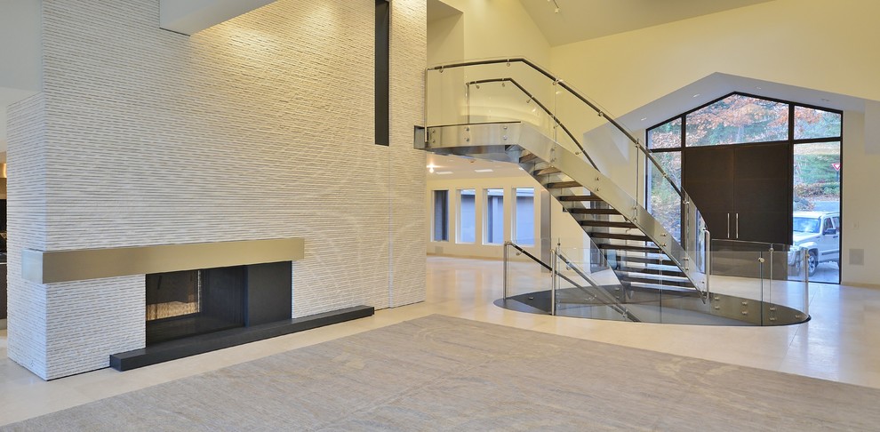 This is an example of a large modern formal open concept living room in Detroit with white walls, ceramic floors, a standard fireplace, a stone fireplace surround, no tv and white floor.