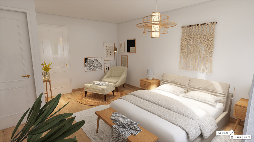 This is an example of a large contemporary bedroom in Rennes with white walls and light hardwood floors.