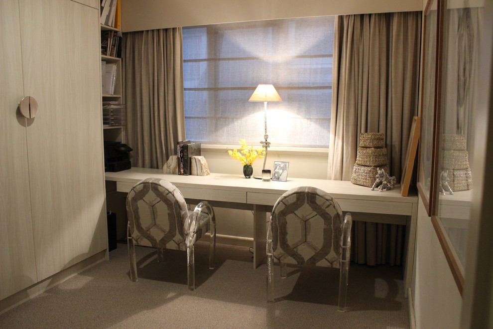 Photo of a small contemporary study room in Melbourne with carpet, a built-in desk and beige walls.