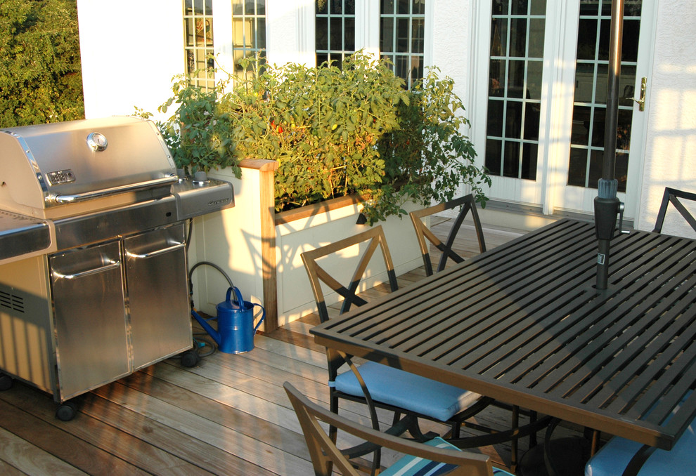 Large modern backyard deck in Philadelphia with a pergola.