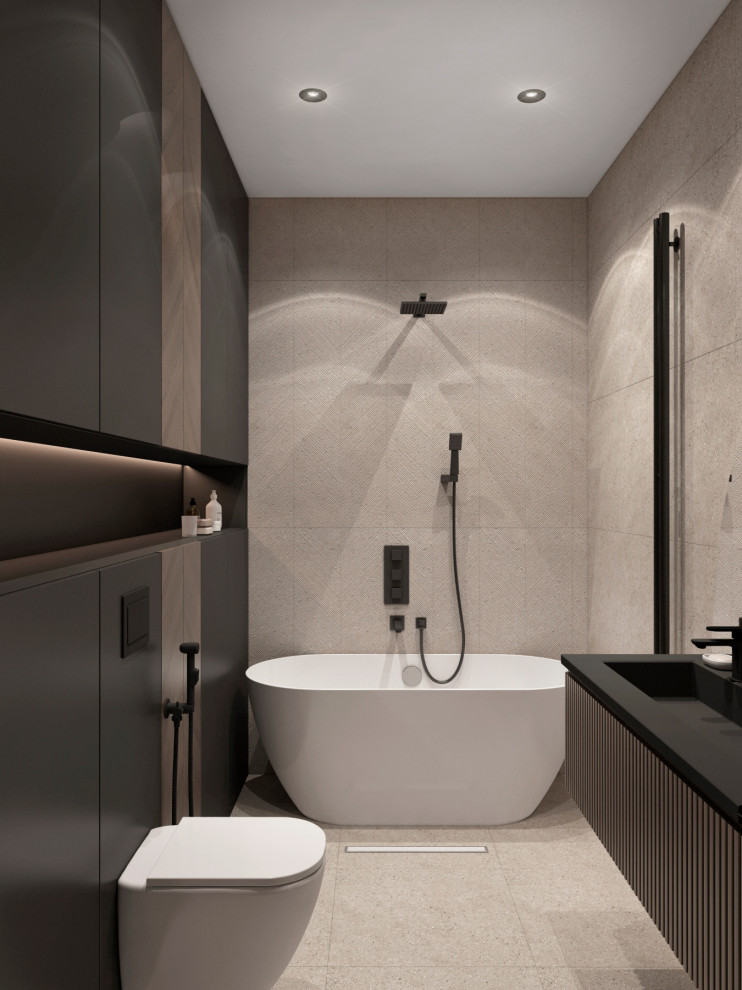 Idéer för funkis svart badrum, med ett fristående badkar, beige kakel och stenhäll