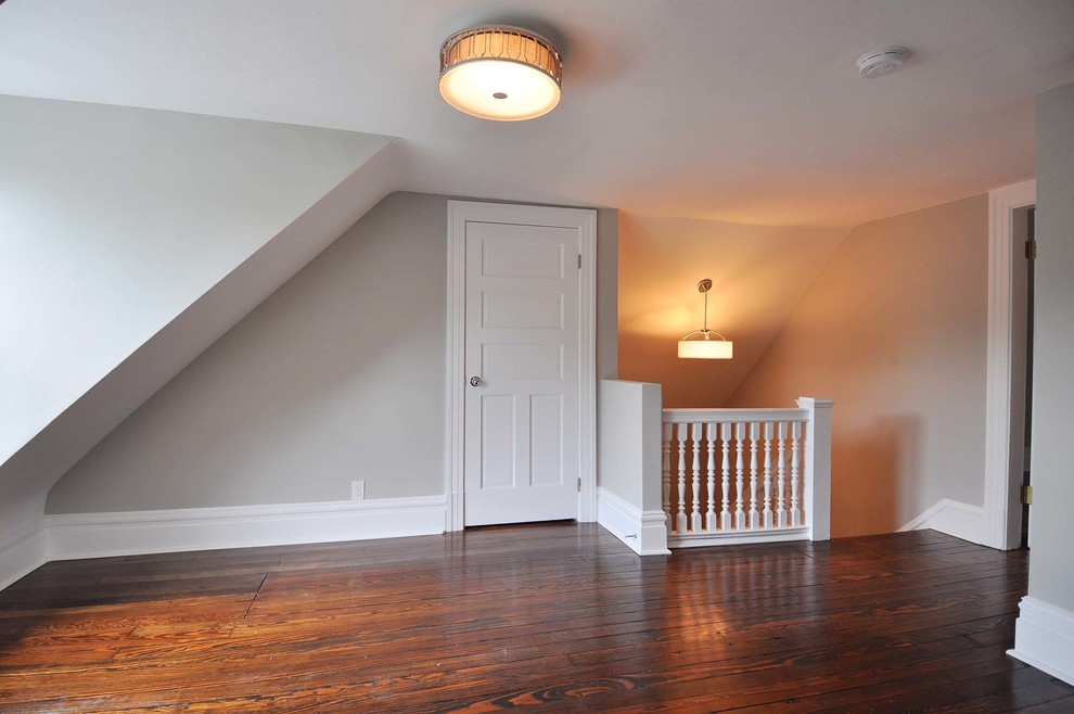 Mid-sized transitional loft-style family room in St Louis with medium hardwood floors.
