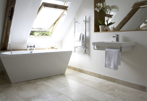 Design ideas for a small contemporary master bathroom in Sydney with a wall-mount sink, wood benchtops, a freestanding tub, an open shower, a wall-mount toilet, beige tile, stone tile, beige walls and limestone floors.