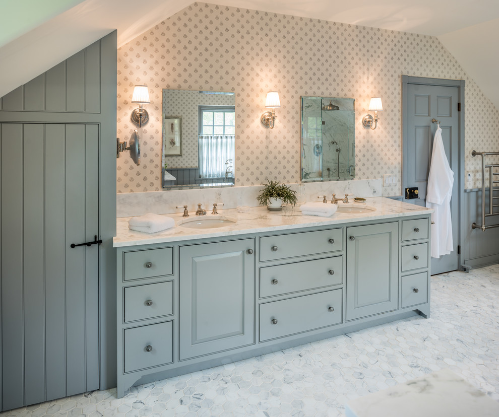 Design ideas for a large traditional master bathroom in Philadelphia with beaded inset cabinets, blue cabinets, marble floors, an undermount sink, marble benchtops, multi-coloured walls and grey floor.