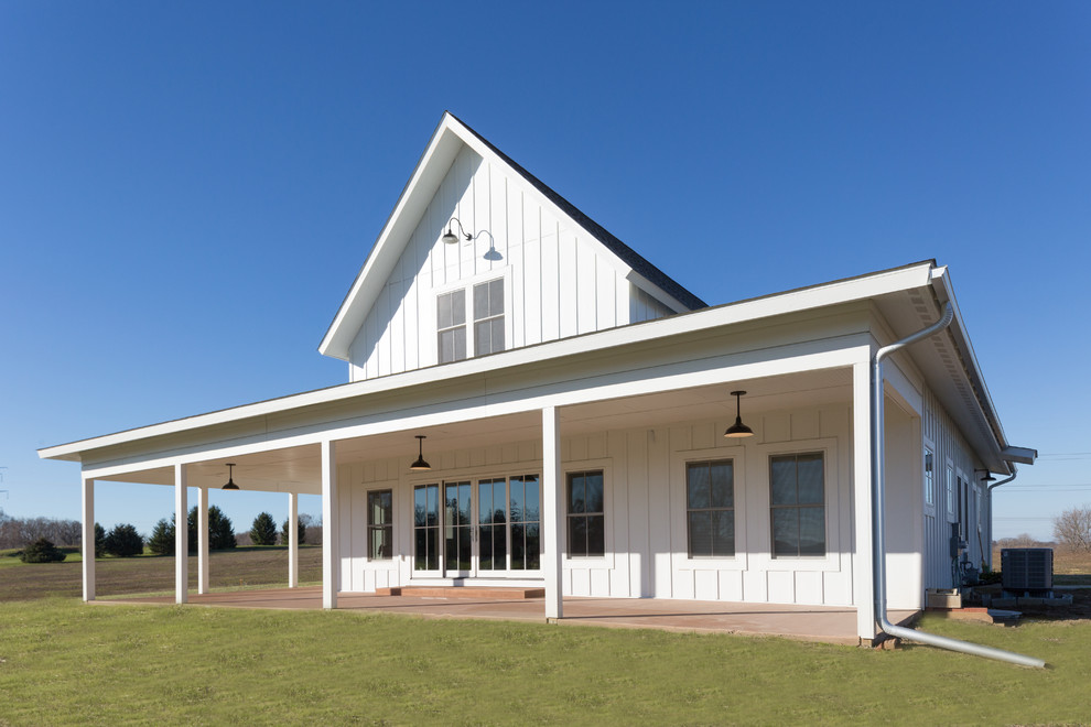 Mid-sized cottage white two-story wood exterior home photo in Detroit with a shingle roof