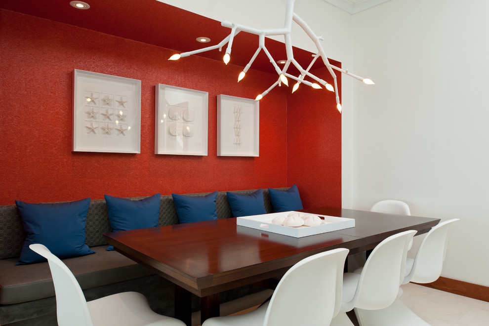 Photo of a contemporary dining room in Denver with red walls.