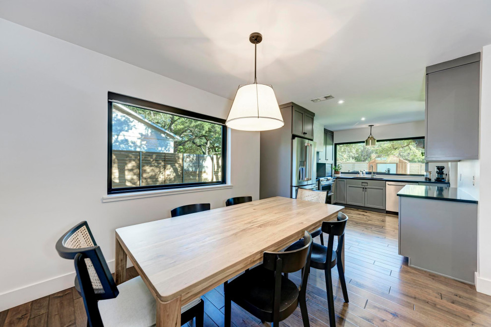 Example of a transitional dining room design in Austin