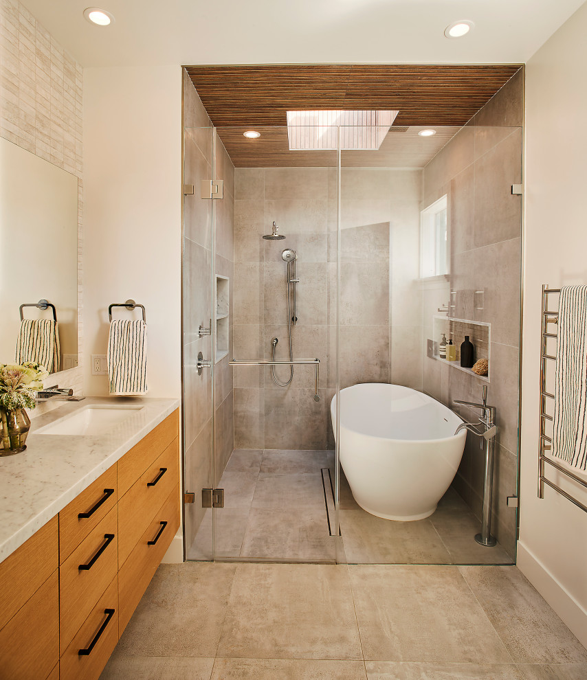 Trendy gray tile gray floor and double-sink bathroom photo in San Francisco with flat-panel cabinets, medium tone wood cabinets, beige walls, an undermount sink, a hinged shower door, gray countertops and a floating vanity
