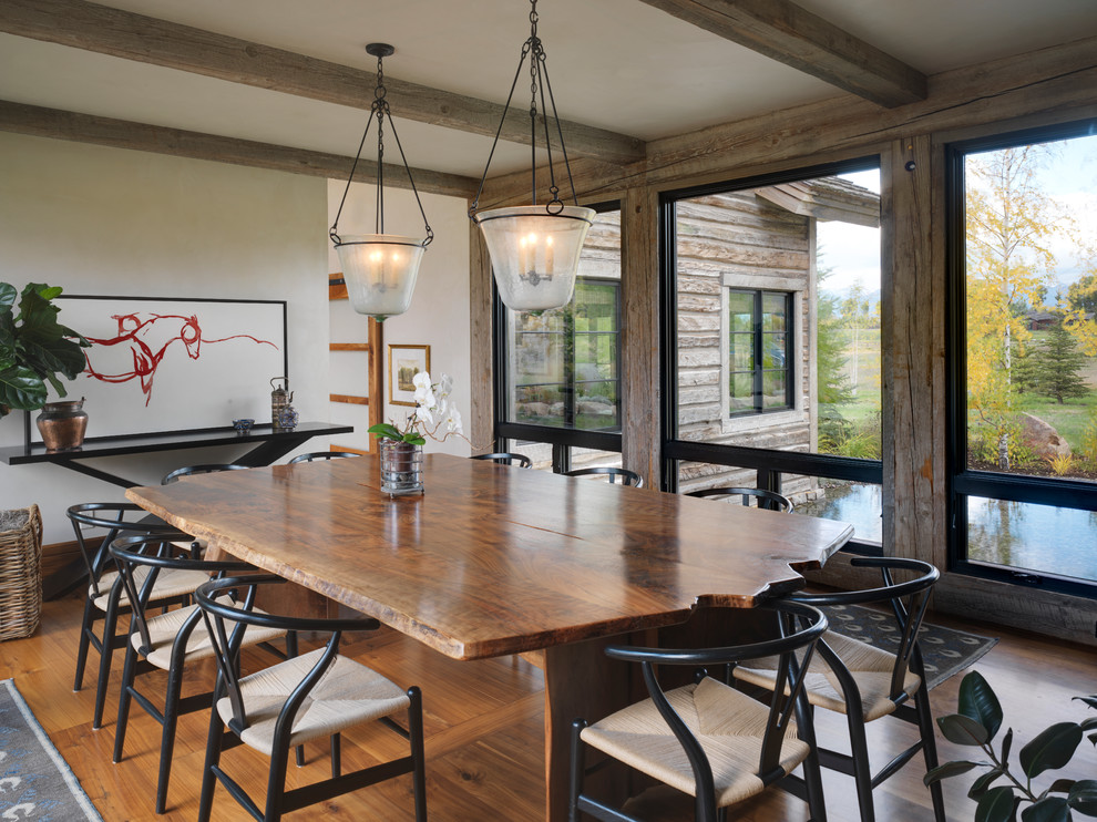 Inspiration for a mid-sized country separate dining room in Other with white walls and medium hardwood floors.