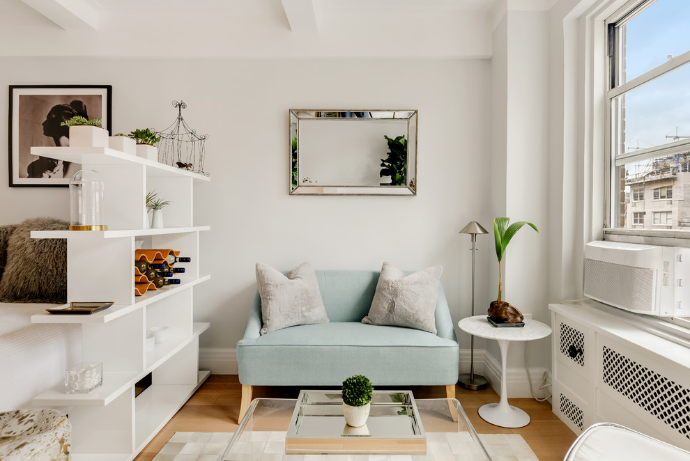 Inspiration for a small contemporary medium tone wood floor and brown floor living room remodel in Other with gray walls