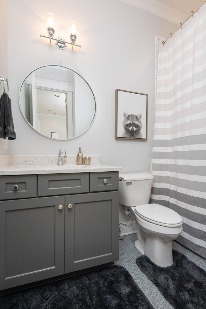Design ideas for a beach style bathroom in Nashville with shaker cabinets, grey cabinets, an alcove shower, grey walls, an undermount sink, grey floor, a shower curtain, white benchtops, a single vanity, a built-in vanity and mosaic tile floors.