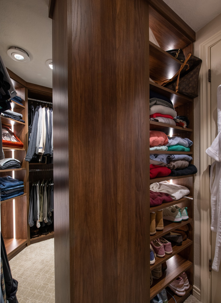 Design ideas for a medium sized traditional gender neutral walk-in wardrobe in Denver with flat-panel cabinets, medium wood cabinets, marble flooring and beige floors.