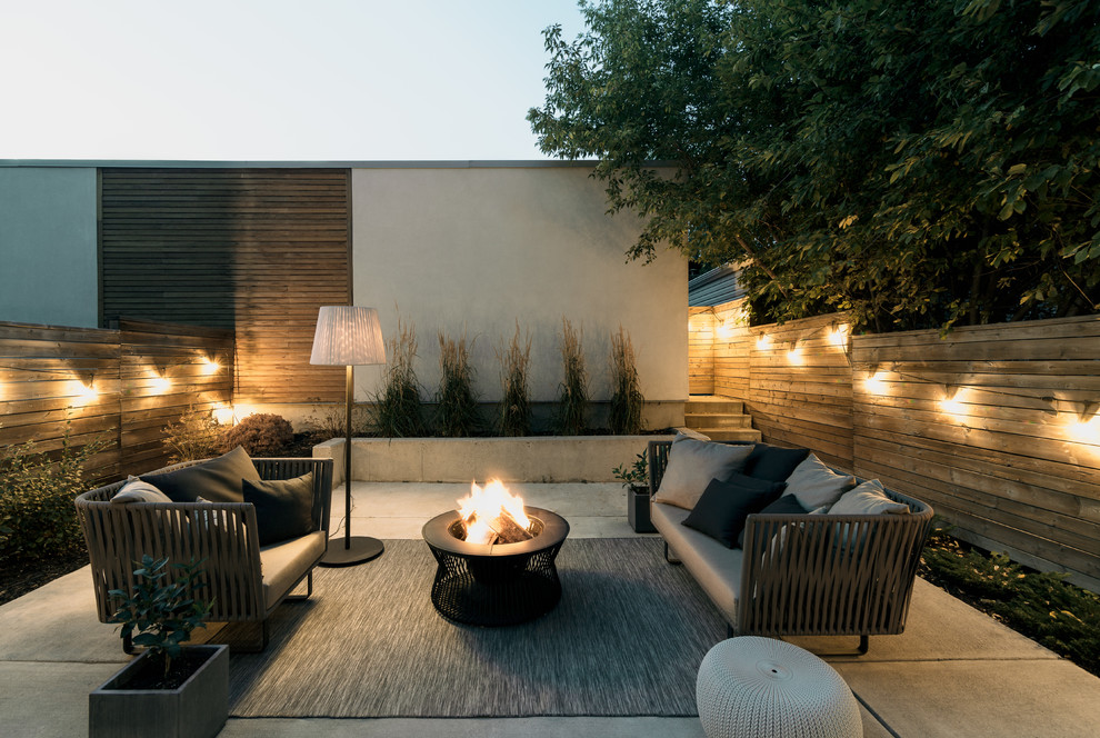 Design ideas for a contemporary patio in Calgary with concrete slab and no cover.