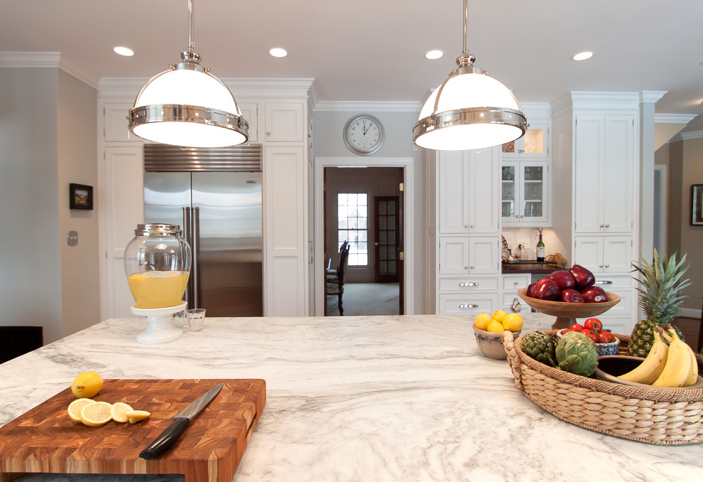 Large transitional kitchen photo in DC Metro with beaded inset cabinets, white cabinets, marble countertops, white backsplash, subway tile backsplash, stainless steel appliances and an island